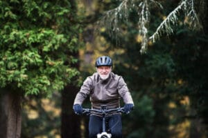 Senior riding a bicycle, concept of balance training for seniors