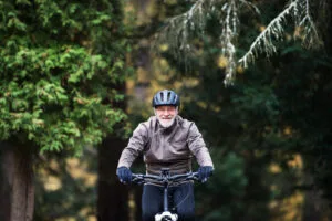 Senior riding a bicycle, concept of balance training for seniors